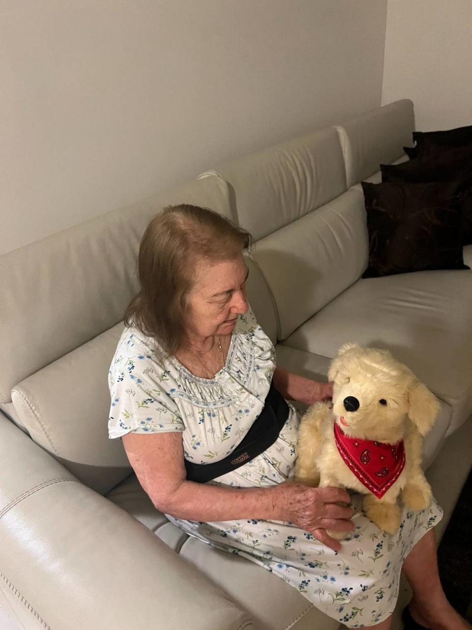 A senior sits with an interactive pet given to her by the Alliance for Aging, the agency that works with seniors in Miami-Dade and Monroe counties. The electronic pet, which sounds like a real animal, helps seniors combat loneliness.