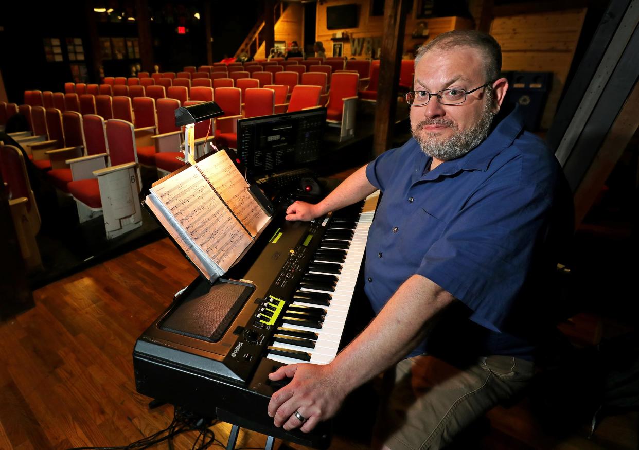 Bradley Wyner poses for a portrait with his keyboard at Western Reserve Playhouse Tuesday, Aug. 1, 2023, in Bath, Ohio. Wyner is the music director for the company’s production of “Jekyll & Hyde,” which will run Aug. 11-26.