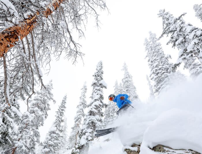 A skier jumps over a cliff