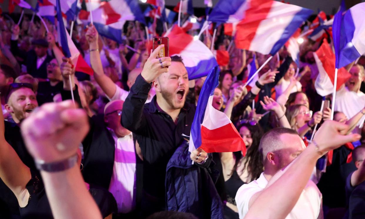 <span>Rassemblement National supporters react to a speech by Marine Le Pen in Henin-Beaumont, northern France, on Sunday.</span><span>Photograph: François Lo Presti/AFP/Getty Images</span>