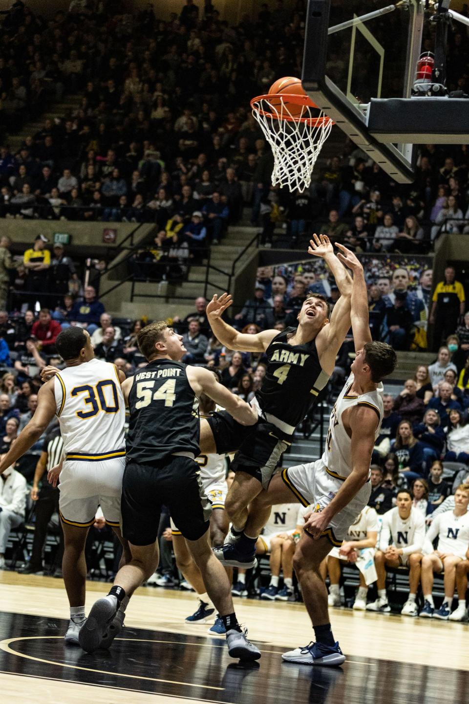 Army's Chris Mann scores on a tough shot in the paint against Navy on Saturday. ALLYSE PULLIAM/For the Times Herald-Record