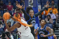 South Carolina's Aliyah Boston (4) tries to shoot against Kentucky's Olivia Owens (00) and Dre'una Edwards (44) in the first half of the NCAA women's college basketball Southeastern Conference tournament championship game Sunday, March 6, 2022, in Nashville, Tenn. (AP Photo/Mark Humphrey)