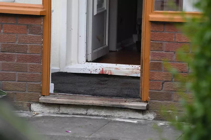 Blood at the entrance of a house on Croxdale Road West after two men were stabbed