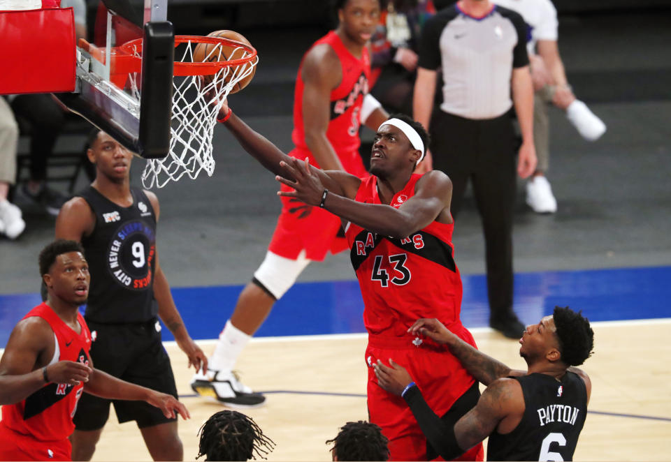 Toronto Raptors forward Pascal Siakam (43) goes to the basket against New York Knicks guard Elfrid Payton (6) during the first half of an NBA basketball game Saturday, April 24, 2021, in New York. (AP Photo/Noah K. Murray)