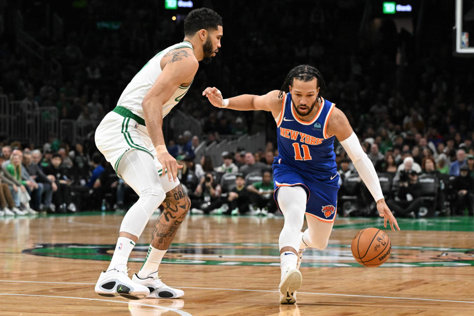 BOSTON, MASSACHUSETTS - APRIL 11: Jalen Brunson #11 of the New York Knicks drives to the basket against Jayson Tatum #0 of the Boston Celtics during the first quarter at the TD Garden on April 11, 2024 in Boston, Massachusetts. NOTE TO USER: User expressly acknowledges and agrees that, by downloading and or using this photograph, User is consenting to the terms and conditions of the Getty Images License Agreement. (Photo by Brian Fluharty/Getty Images)