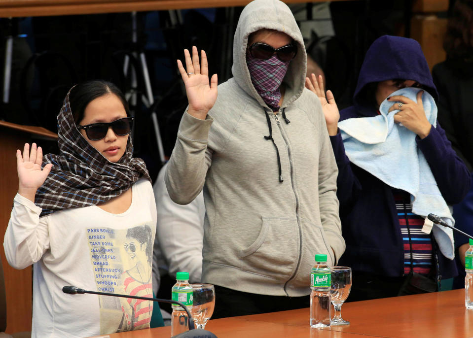 <p>Relatives of slain people take the oath at a Senate hearing investigating drug-related killings at the Senate headquarters in Pasay city, metro Manila, Philippines, Aug. 22, 2016. (REUTERS/Romeo Ranoco) </p>