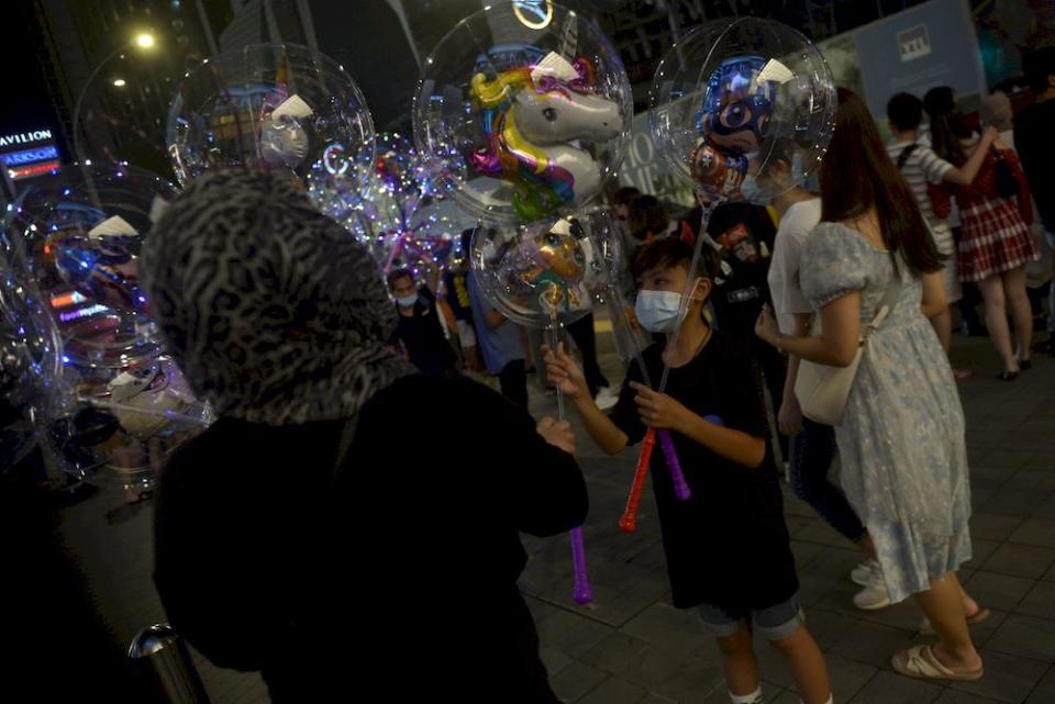 People hanging around Bukit Bintang on New Year’s Eve, December 31,2020. — Picture by Miera Zulyana