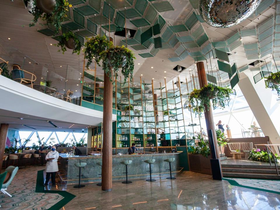 hanging plants and green decor around the multi-floor Eden venue