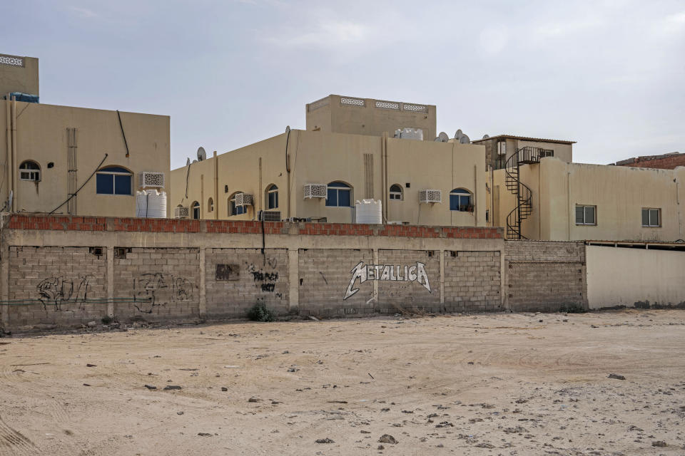 Graffiti depicting the U.S. band Metallica is displayed on a wall of a residential block in Al Rayyan, Doha, Qatar, Saturday, Oct. 15, 2022. (AP Photo/Nariman El-Mofty)