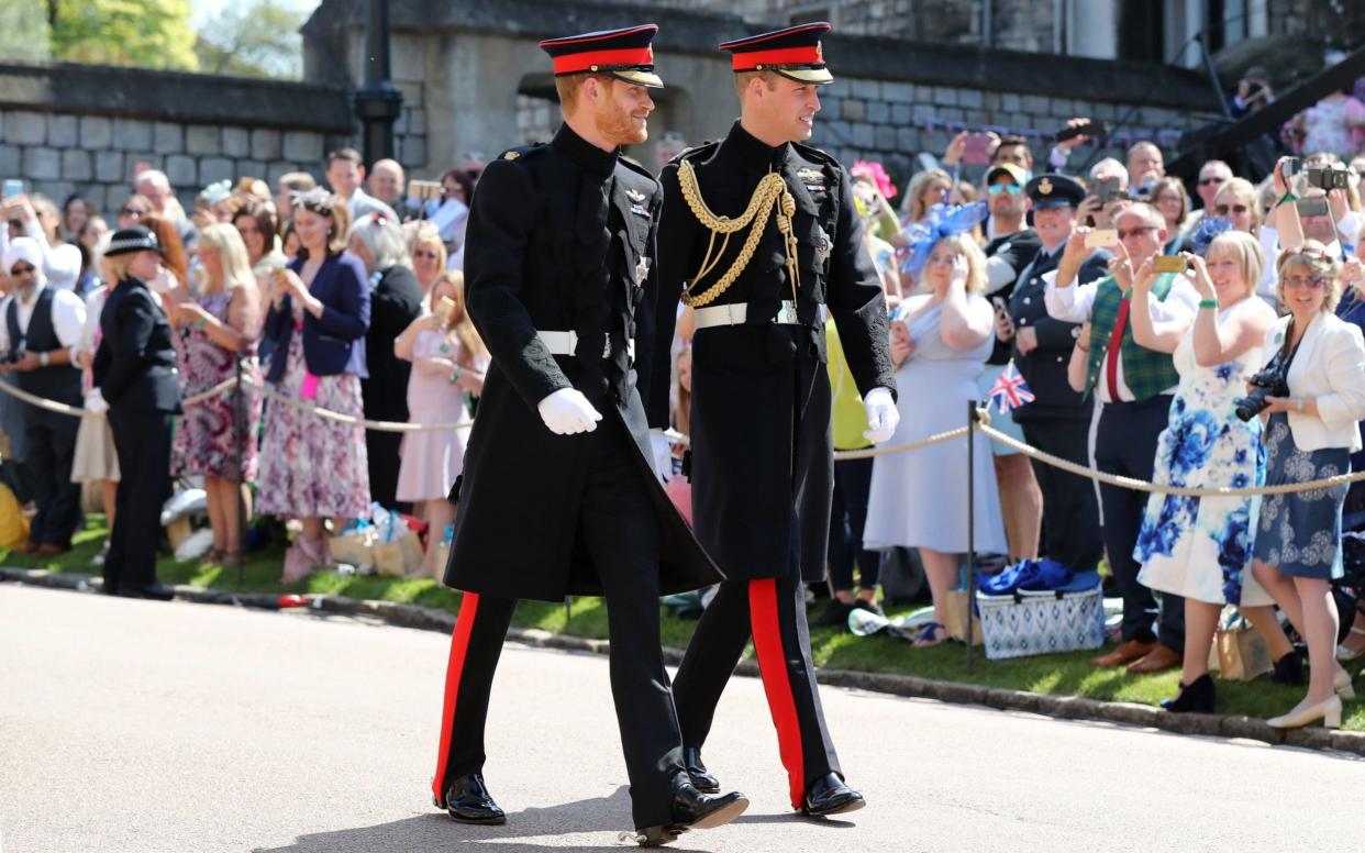 Prince Harry and the Duke of Cambridge making their way to the chapel - PA