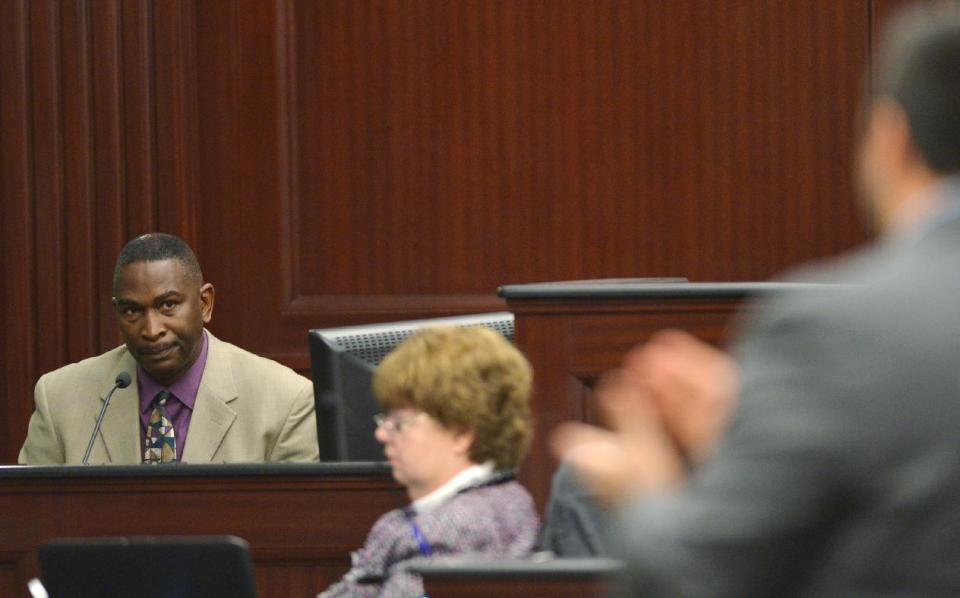 Ronald Davis, father of the victim, Jordan Davis, testifies in the trial of Michael Dunn in Jacksonville, Fla., Monday Feb. 10, 2014. Prosecutors rested their case Monday in the trial of Dunn who is charged with killing Jordan Davis after an argument over loud music outside a Jacksonville convenience store in 2012. (AP Photo/The Florida Times-Union, Bob Mack, Poo)