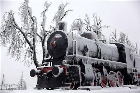 An ice covered steam locomotive is seen in Postojna railway station February 4, 2014. REUTERS/Srdjan Zivulovic