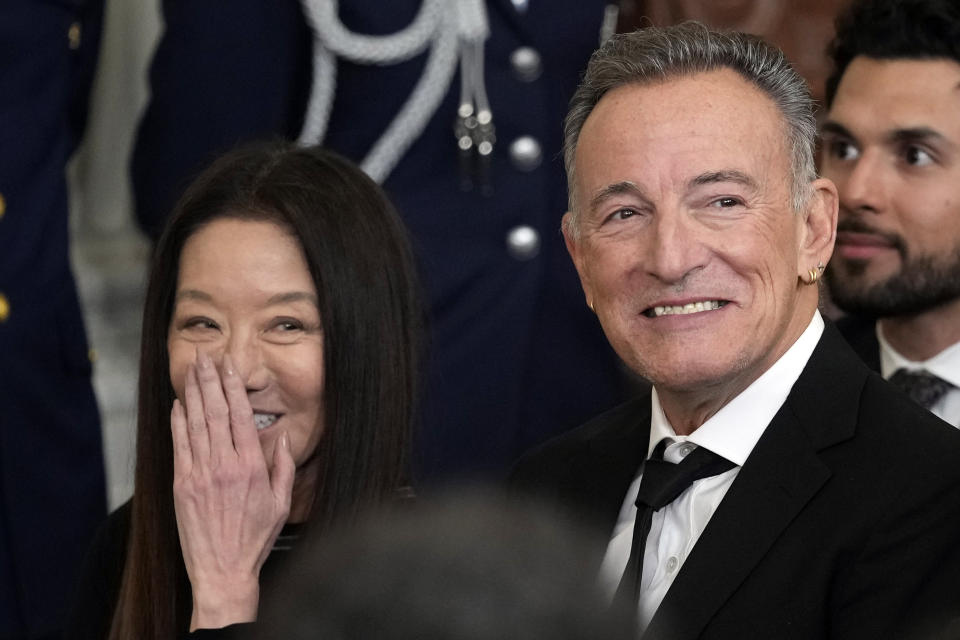 Vera Wang reacts as President Joe Biden talks about her before presents the 2021 National Medal of Arts to her and Bruce Springsteen, right, at White House in Washington, Tuesday, March 21, 2023. (AP Photo/Susan Walsh)