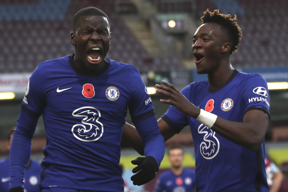 Chelsea's Kurt Zouma, left, celebrates scoring his sides second goal with Chelsea's Tammy Abraham during the English Premier League soccer match between Burnley and Chelsea at Turf Moor stadium in Burnley, England, Saturday, Oct. 31, 2020. (Molly Darlington/Pool via AP)