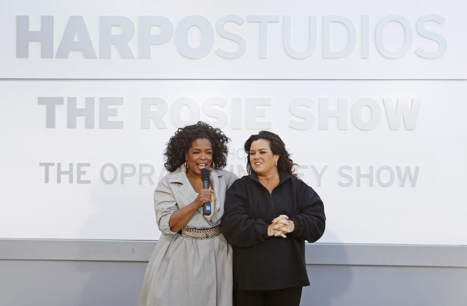 FILE-This Sept. 15, 2011, file photo shows Rosie O'Donnell, right, and Oprah Winfrey speaking to the media after the unveiling of a new sign outside Harpo Studios welcoming "The Rosie Show," to the studio in Chicago. Winfrey is selling Harpo Studios in Chicago to a developer, but the studio will remain on the property for another two years. Harpo Inc. said in a statement that it has entered into a purchasing agreement with Sterling Bay Cos. for the four-building campus on Chicago's West Side. (AP Photo/M. Spencer Green, File)