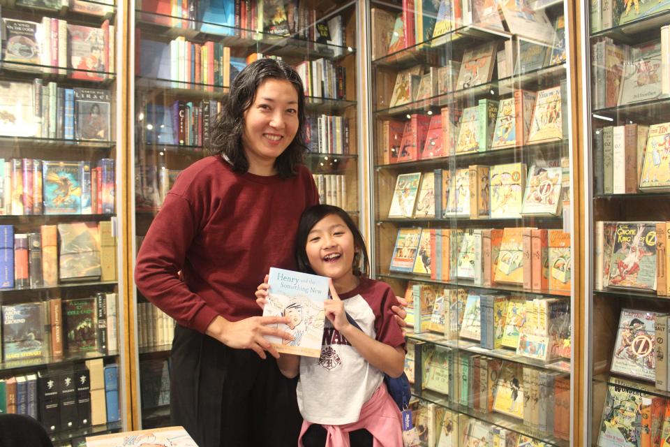 Illustrator Mika Song and her 8-year-old daughter Valerie Song, an avid reader.