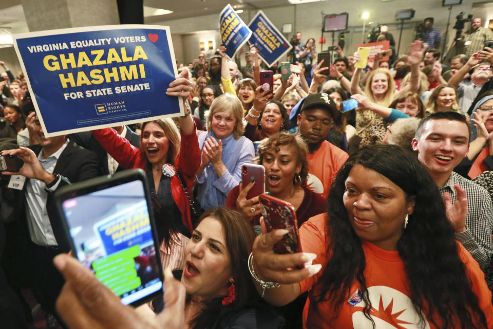 Democratic supporters cheer at their party in Richmond, Va., Tuesday, Nov. 5, 2019. All seats in the Virginia House of Delegates and State Senate are up for election. (AP Photo/Steve Helber)