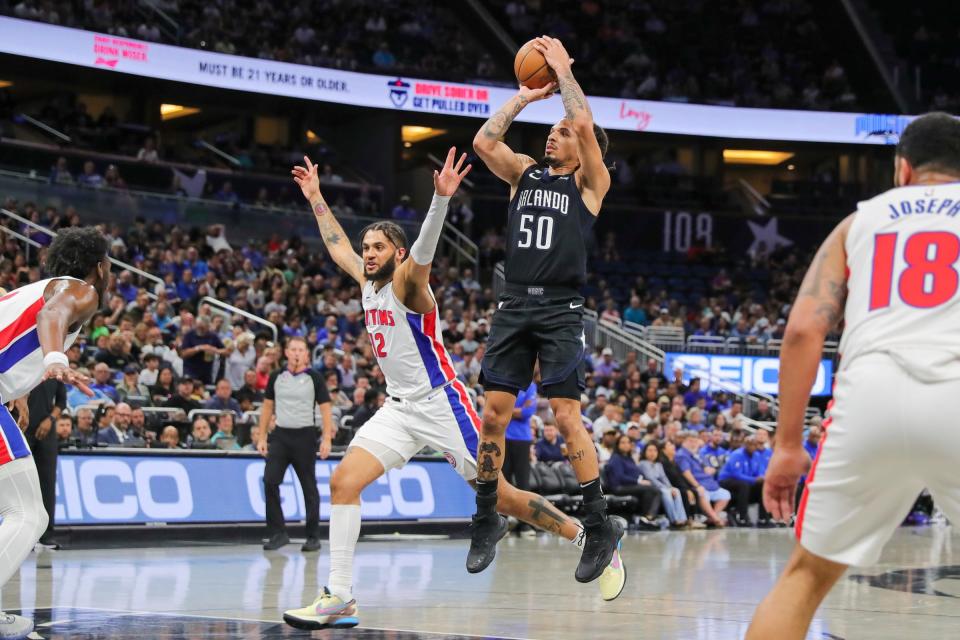 Magic guard Cole Anthony shoots the ball against Pistons forward Isaiah Livers during the second quarter on Thursday, Feb. 23, 2023, in Orlando, Florida.