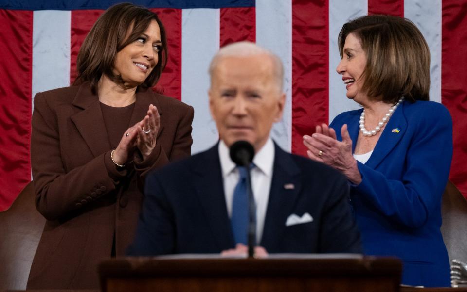 Kamala Harris and Nancy Pelosi applaud as President Joe Biden delivers his first State of the Union address