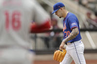 New York Mets pitcher José Buttó (70) reacts after walking Philadelphia Phillies' Brandon Marsh (16) with the bases loaded during the third inning of a baseball game Tuesday, May 14, 2024, in New York. (AP Photo/Adam Hunger)