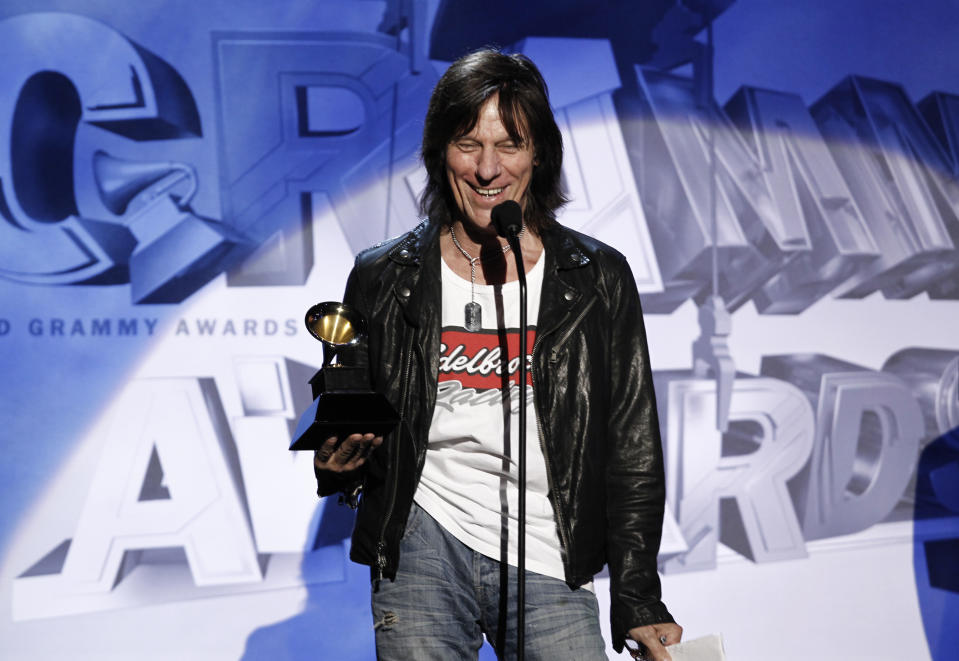 FILE - Jeff Beck accepts the Grammy for best Pop Instrumental Performance for "Nessun Dorma" during the pre-telecast at the 53rd annual Grammy Awards on Feb. 13, 2011, in Los Angeles. Beck, a guitar virtuoso who pushed the boundaries of blues, jazz and rock 'n' roll, influencing generations of shredders along the way and becoming known as the guitar player's guitar player, died Tuesday, Jan. 10, 2023, after "suddenly contracting bacterial meningitis," his representatives said in a statement released Wednesday. He was 78. (AP Photo/Matt Sayles, File)