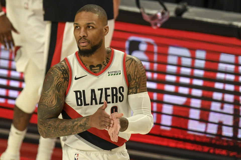 Damian Lillard rubs his hands together during a Trail Blazers game.