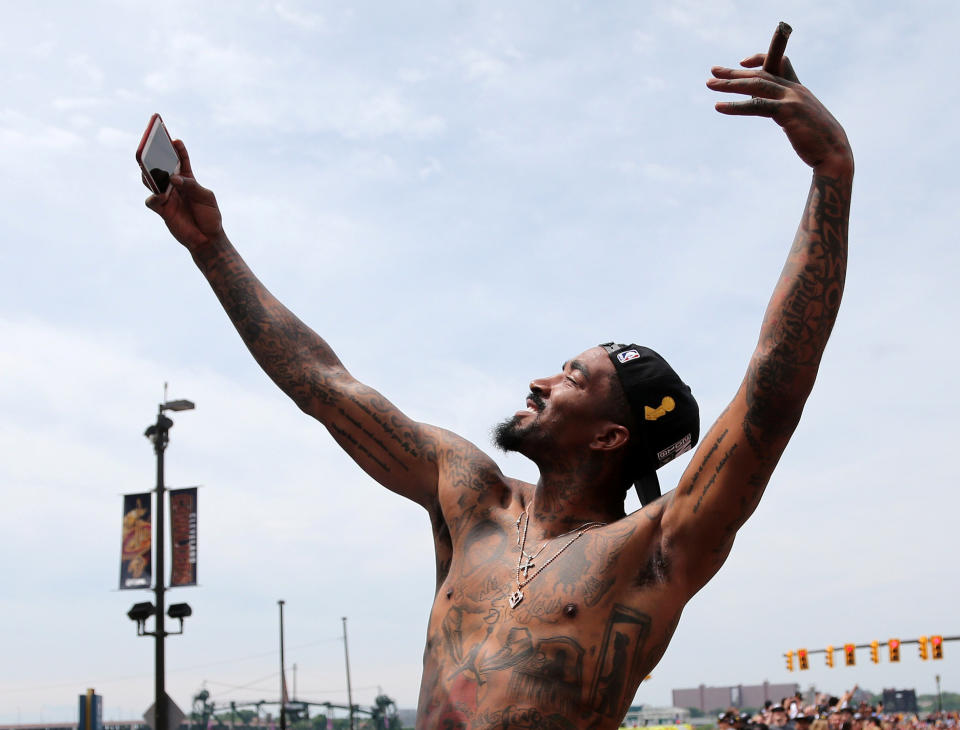 Cleveland Cavaliers JR Smith takes a selfie during a parade to celebrate winning the 2016 NBA Championship in downtown Cleveland, Ohio, U.S. June 22, 2016. REUTERS/Aaron Josefczyk