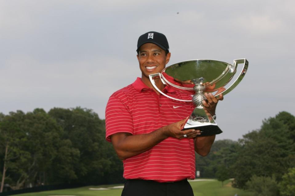 Tiger Woods holds the FedEx Cup trophy following the final round of the TOUR Championship, the final event of the new PGA TOUR Playoffs for the FedExCup at East Lake Golf Club on September 16, 2007, in Atlanta, Georgia. (Photo by S.Greenwood/Getty Images)