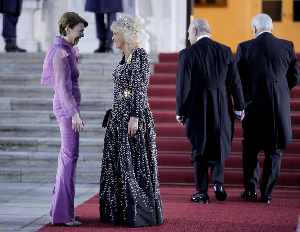 FILE - German President Frank-Walter Steinmeier's wife Elke Buedenbender, left, and Camilla, the Queen Consort, talk in front of the Bellevue Palace in Berlin, Wednesday, March 29, 2023. King Charles III won plenty of hearts during his three-day visit to Germany, his first foreign trip since becoming king following the death of his mother, Elizabeth II, last year. (AP Photo/Markus Schreiber, File)