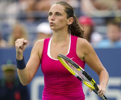 Roberta Vinci of Italy reacts to a point against Agnieszka Radwanska of Poland during their women's singles match at the 2012 US Open tennis tournament in New York. Vinci won 6-1, 6-4