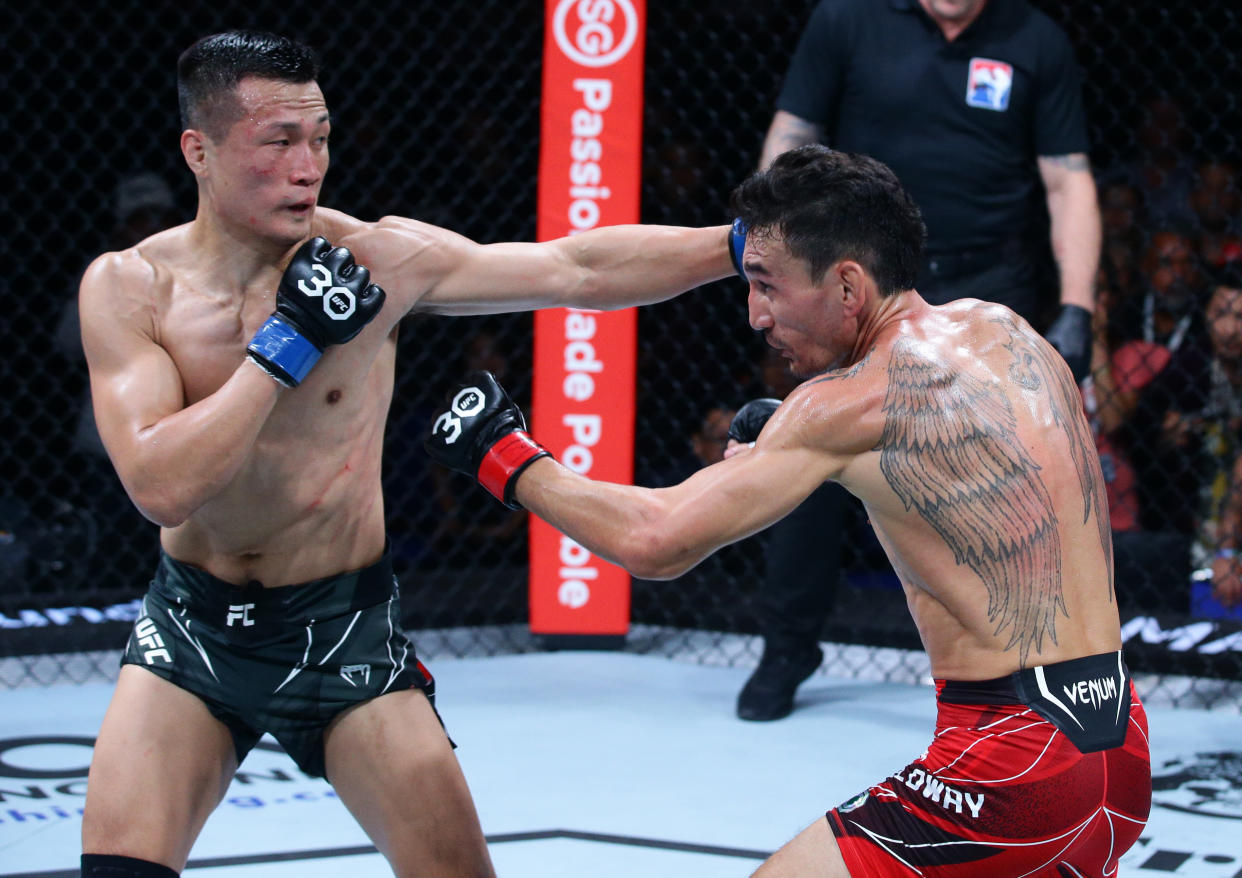 South Korean mixed martial arts fighter Jung Chan-sung battles American Max Holloway in a featherweight bout during the UFC Fight Night event at Singapore Indoor Stadium.