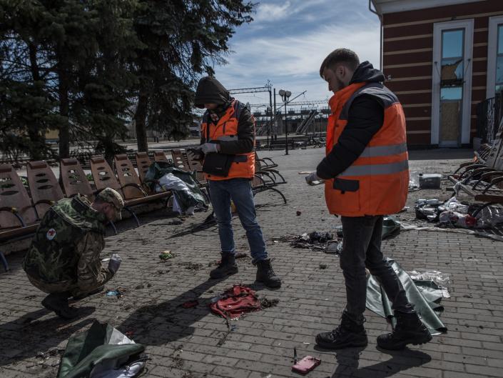 Some volunteers look for traces to help identify the corpses at Kramatorsk railway station after the missile attack in Kramatorsk, Ukraine.