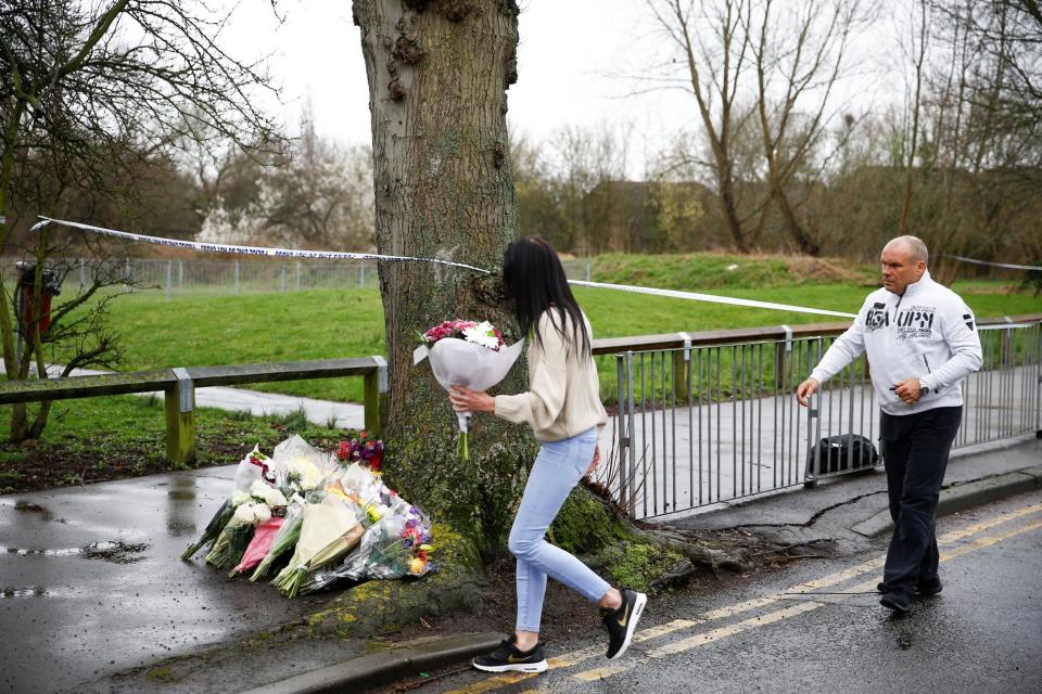 People lay floral tributes near to where 17-year-old Jodie Chesney was killed (REUTERS)