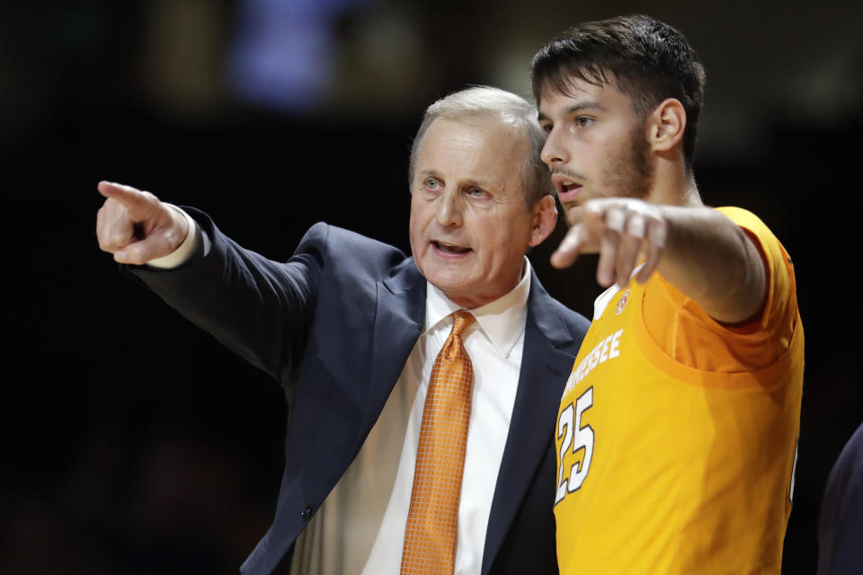 FILE - In this Saturday, Jan. 18, 2020, file photo, Tennessee coach Rick Barnes talks with guard Santiago Vescovi, of Uruguay, during the second half of the team's NCAA college basketball game against Vanderbilt in Nashville, Tenn. With competition canceled across all NCAA divisions due to the coronavirus, many foreign athletes face a dilemma, return home or stay. Tennessee's men’s basketball team has players from France, Serbia, Uruguay and Finland, which meant Mary-Carter Eggert, the director of basketball operations, became a travel agent, looking for the best flights. (AP Photo/Mark Humphrey, File)