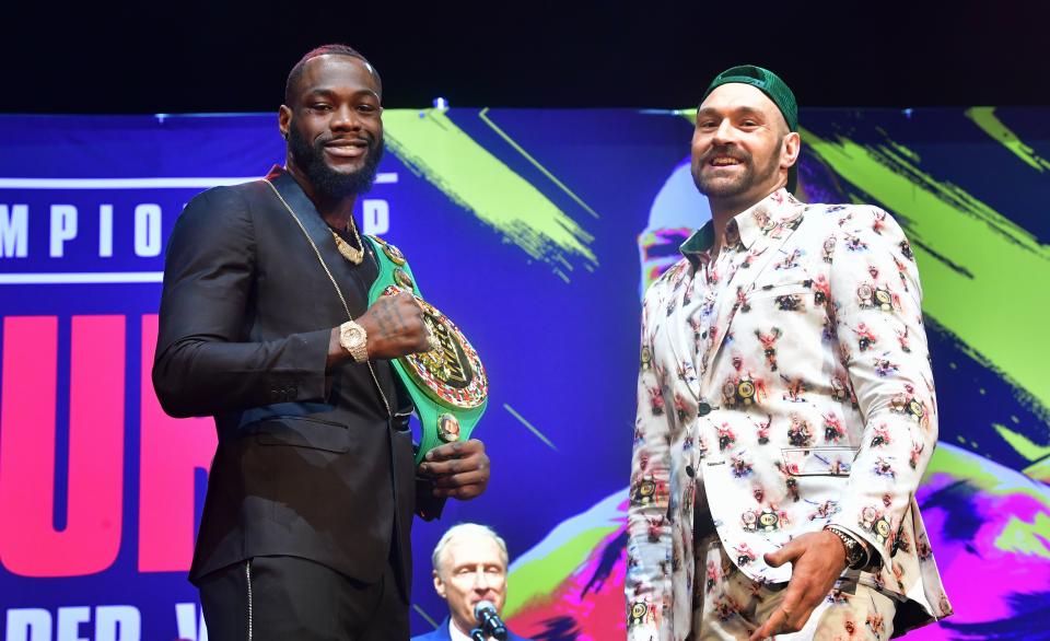 Boxers Deontay Wilder (L) and Tyson Fury (R) meet on stage during a press conference in Los Angeles, California on January 13, 2020 ahead of their re-match fight in Las Vegas on February 22. (Photo by Frederic J. BROWN / AFP) (Photo by FREDERIC J. BROWN/AFP via Getty Images)