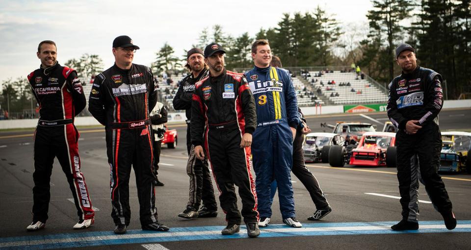 Drivers watch as Matt Hirschman driver of the #60 Elite LFR, not pictured, spins the wheel during the redraw before the Granite State Derby for the NASCAR Whelen Modified Tour at Monadnock Speedway in Winchester, New Hampshire on May 4, 2024. (Jaiden Tripi/NASCAR)