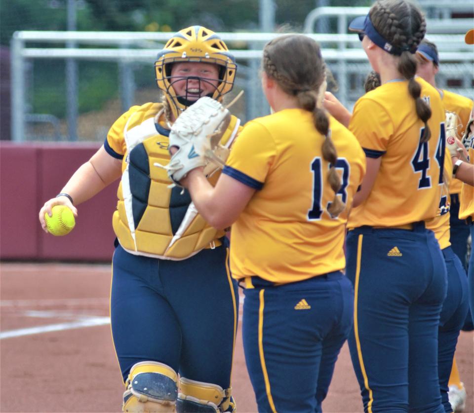 Taylor Moeggenberg shakes hands with her teammates during pregame of an MHSAA Division 2 softball state quarterfinal matchup between Gaylord and Hudsonville Unity Christian on Tuesday, June 13 at Margo Jonker Stadium on the campus of Central Michigan University, Mount Pleasant, Mich.