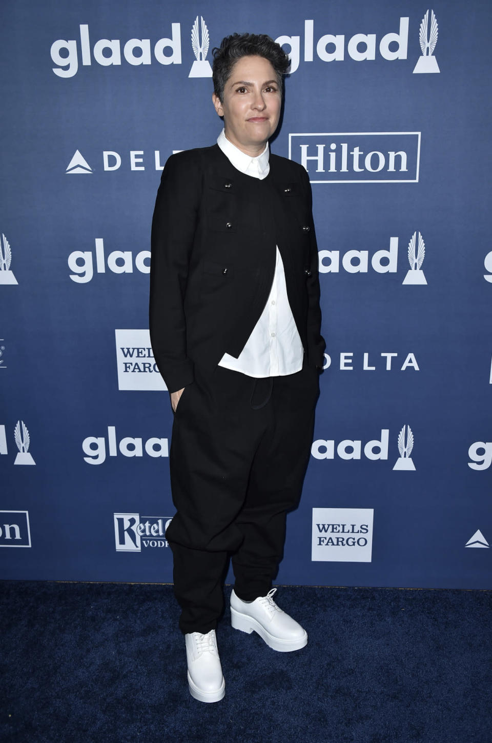 Transparent director Jill Soloway in a deconstructed black-and-white suit with platform sneakers