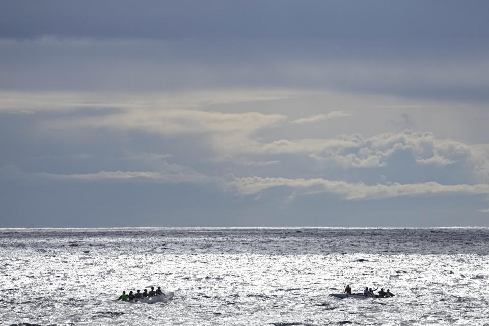Crew members train for the Hoki Mai challenge, a voyage — covering almost 500 kilometers, or about 300 miles across a stretch of the Pacific Ocean, in Rapa Nui, a territory that is part of Chile and is better known as Easter Island, Thursday, Nov. 24, 2022. During the voyage, rowing will be done in relays: groups of six will row for about four hours, then be replaced by the next shift. Those who need to rest will do so in a Chilean navy ship escorting the canoe. (AP Photo/Esteban Felix)