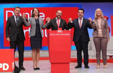 German Chancellor candidate Martin Schulz of the Social Democratic party (SPD) poses with party's board members Thomas Oppermann, Katarina Barley, Hubertus Heil and Manuela Schwesig during the party convention in Dortmund, Germany, June 25, 2017. REUTERS/Wolfgang Rattay