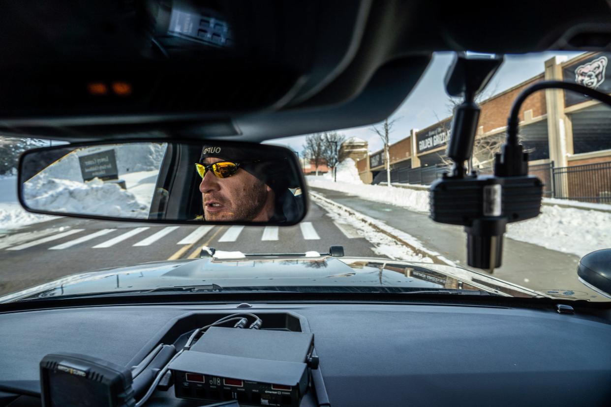 Oakland University Police Department officer Dwayne Rodriguez cruises around campus while on duty at the school in Auburn Hills on Tuesday, Jan. 16, 2024.