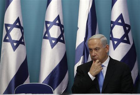 Israel's Prime Minister Benjamin Netanyahu sits after delivering a statement in Jerusalem November 21, 2012. REUTERS/Baz Ratner