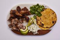 <p>This slow cooker pork carnitas recipe is a perfectly simple and inexpensive way to feed a crowd. Set out a stack of warm corn tortillas along, with a few simple toppings, and allow everyone to pile on the unbelievably rich and tender pork as they please. </p> <p><a href="https://www.myrecipes.com/recipe/slow-cooker-pork-carnitas" rel="nofollow noopener" target="_blank" data-ylk="slk:Slow Cooker Pork Carnitas Recipe;elm:context_link;itc:0;sec:content-canvas" class="link ">Slow Cooker Pork Carnitas Recipe</a></p>