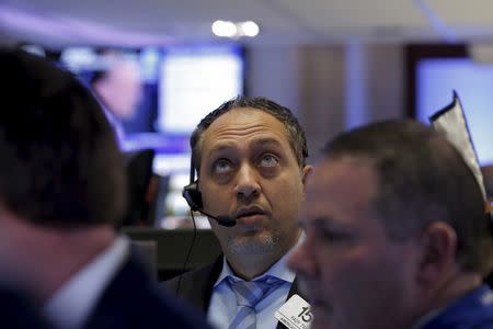 Traders work on the floor of the New York Stock Exchange (NYSE) February 8, 2016. REUTERS/Brendan McDermid