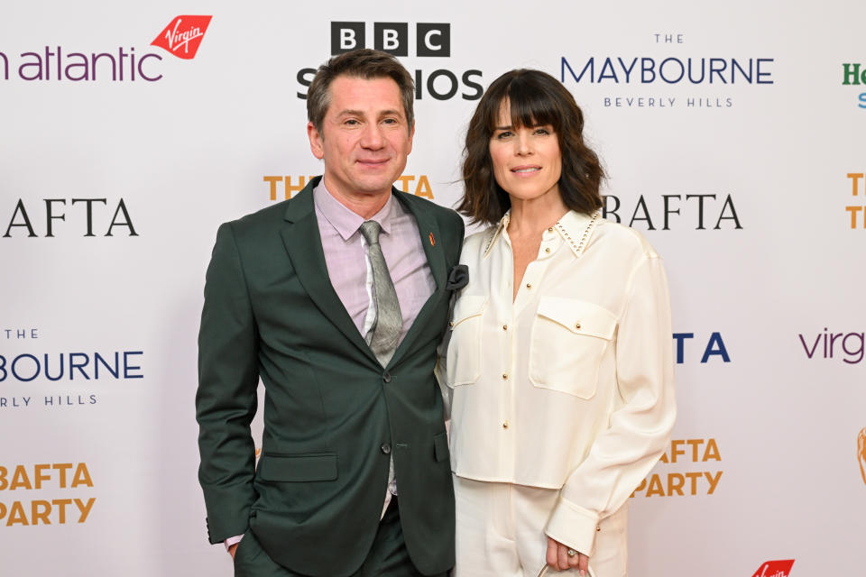 Michael A. Goorjian and Neve Campbell at the BAFTA Tea Party held at The Maybourne Beverly Hills on January 13, 2024 in Beverly Hills, California.