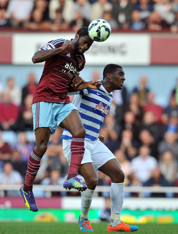 West Ham United's midfielder Alex Song (L) vies with Queens Park Rangers' midfielder Leroy Fer (R) during during their English Premier League football match on October 5, 2014