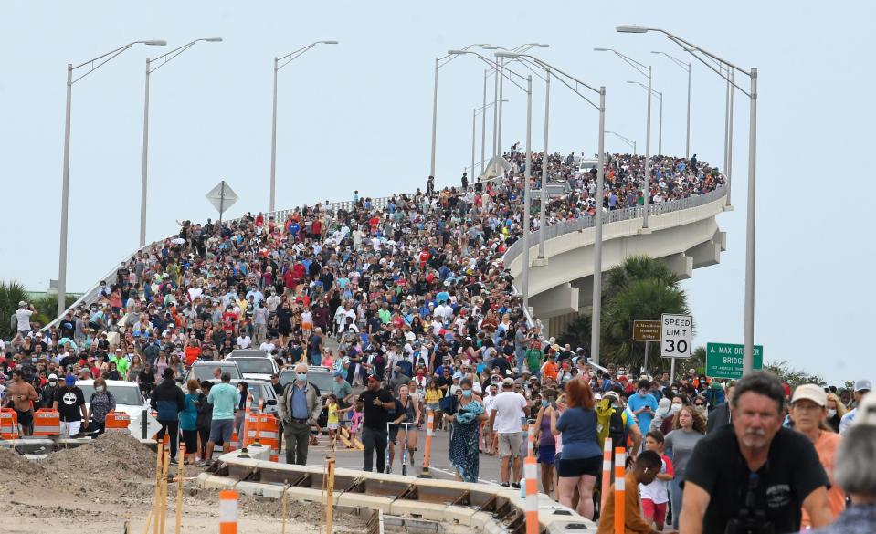 Huge crowds of launch spectators on the A. Max Brewer Bridge in Titusville walk back to their vehicles in May 2020 after a scrub of the historic SpaceX Demo-2 flight, the first American crewed mission in nearly a decade.