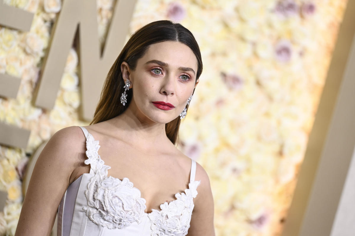 Elizabeth Olsen Goes Ethereal in White Vivienne Westwood Lace Dress at