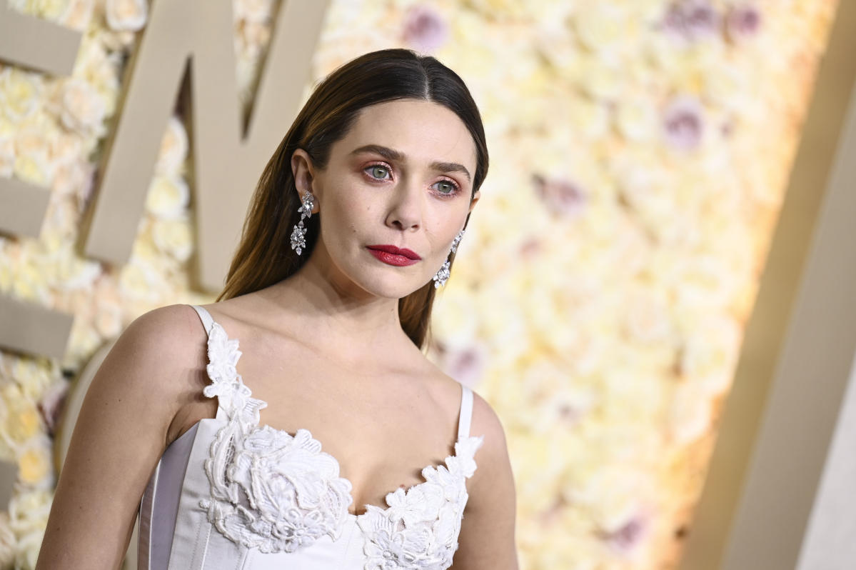 Elizabeth Olsen Goes Ethereal in White Vivienne Westwood Lace Dress at  Golden Globes 2024