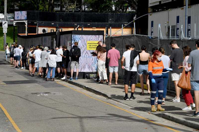 Members of the public queue for Covid-19 PCR tests at a clinic in Redfern in Sydney.